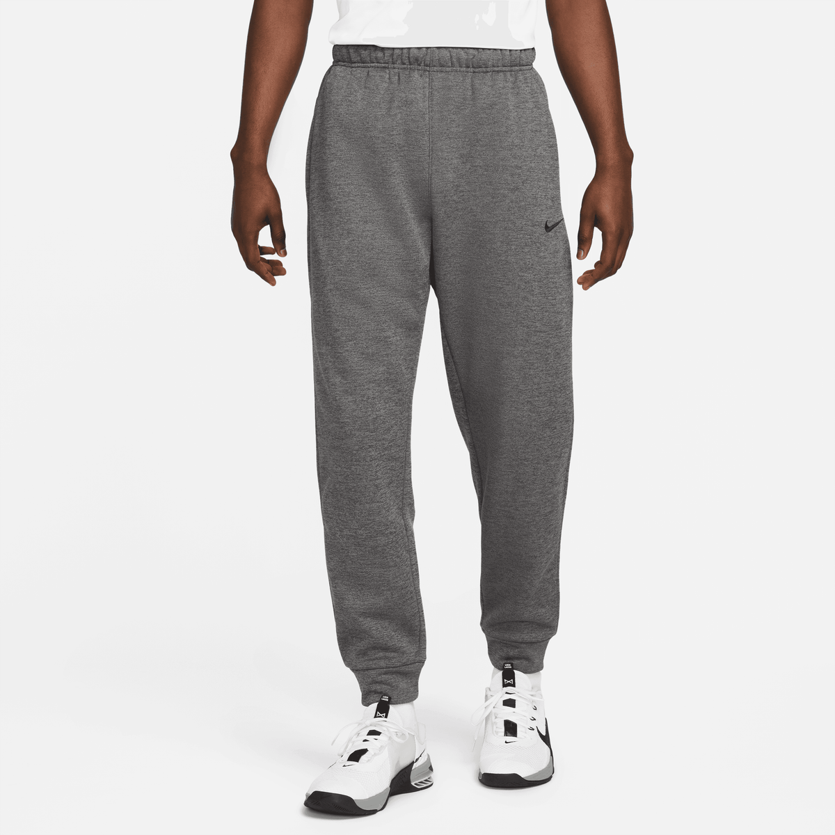 Nike Men Therma-FIT Tapered Fitness Pants product image 1, provided for visual reference and product detail review